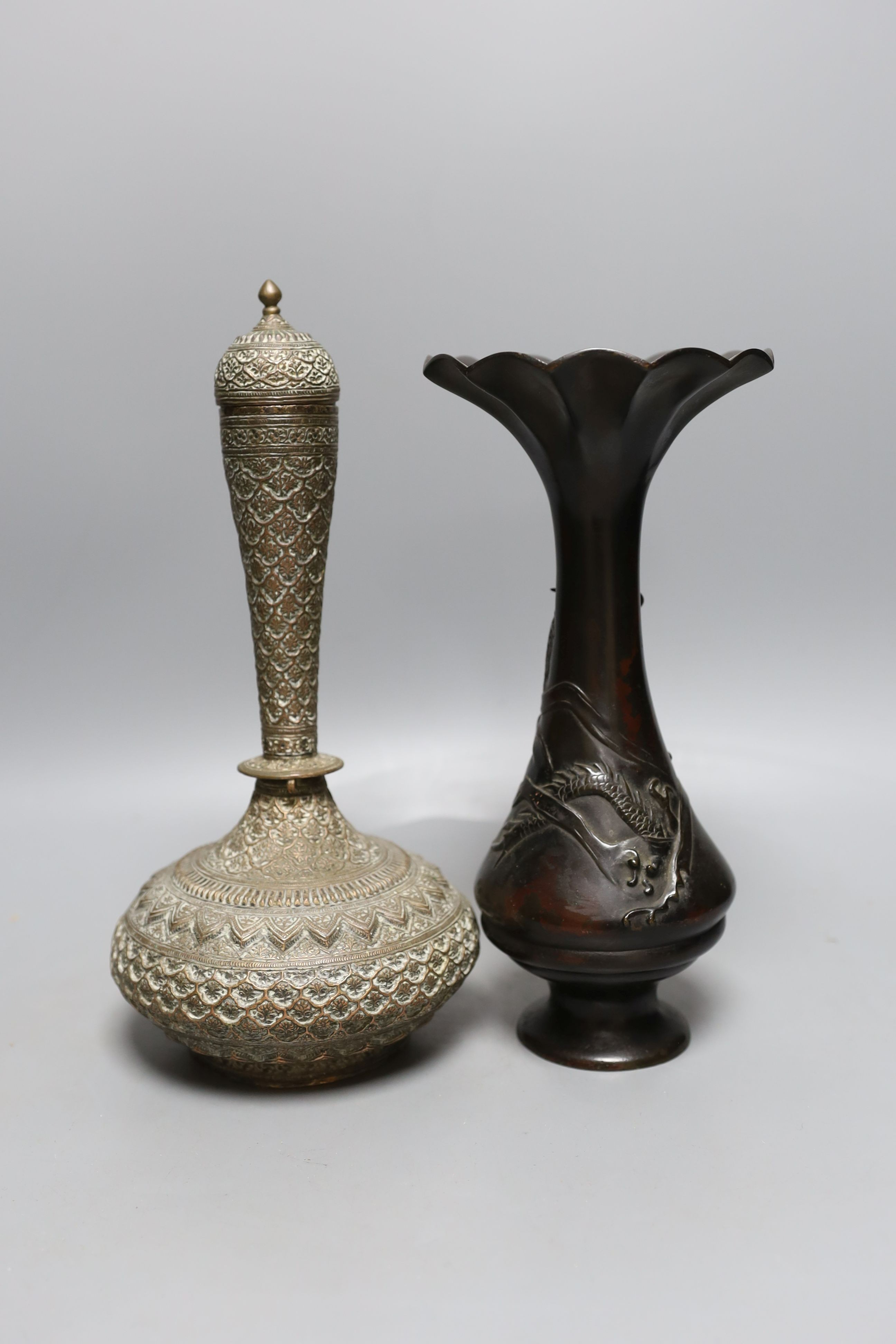 A Japanese bronze vase, an Islamic brass bottle, Chinese enamelled porcelain bowl, bronze group of man riding an ox. 29cm
